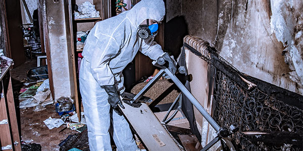 service tech cleaning up home after a fire